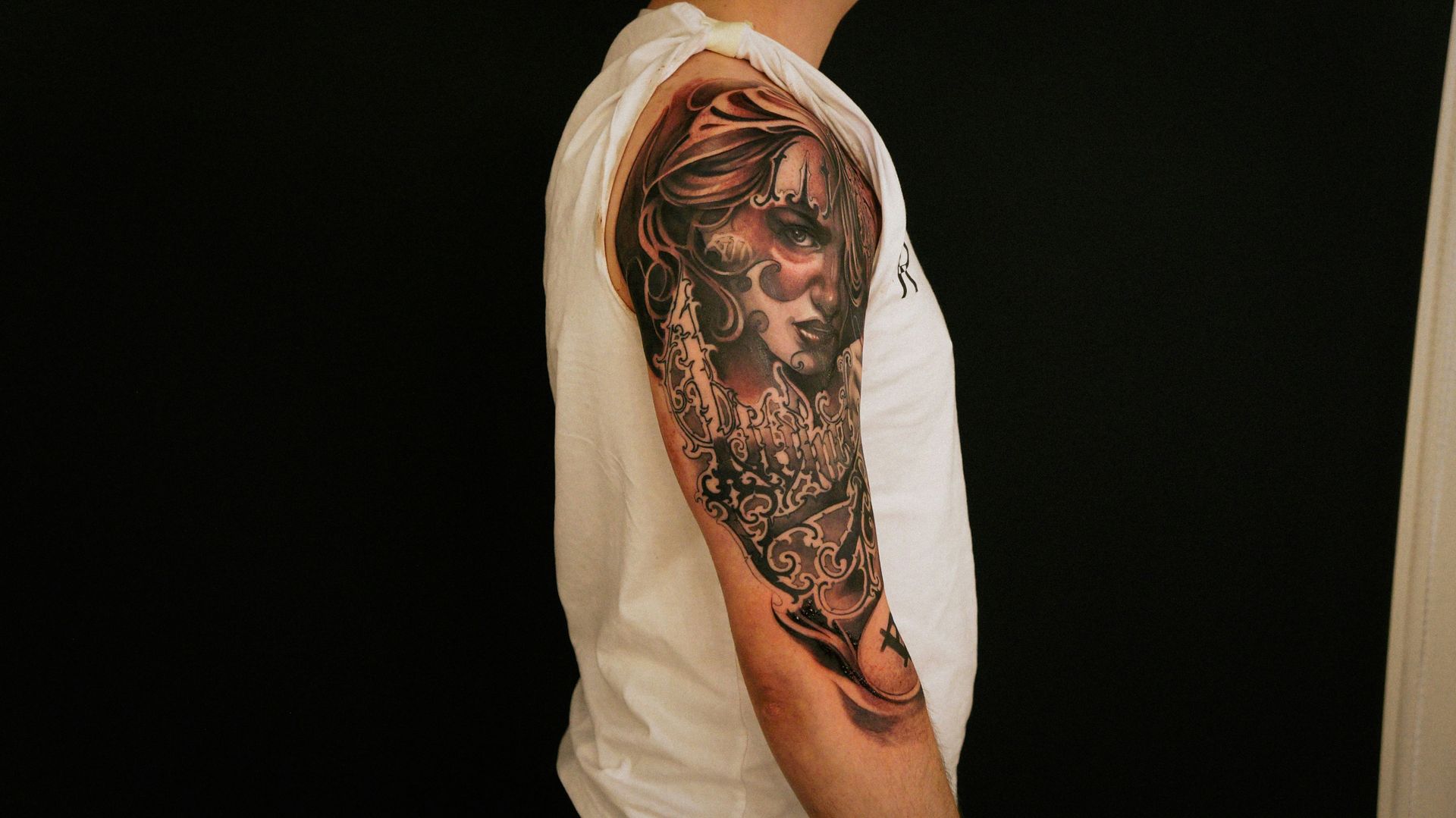 a person with a tattoo on their arm